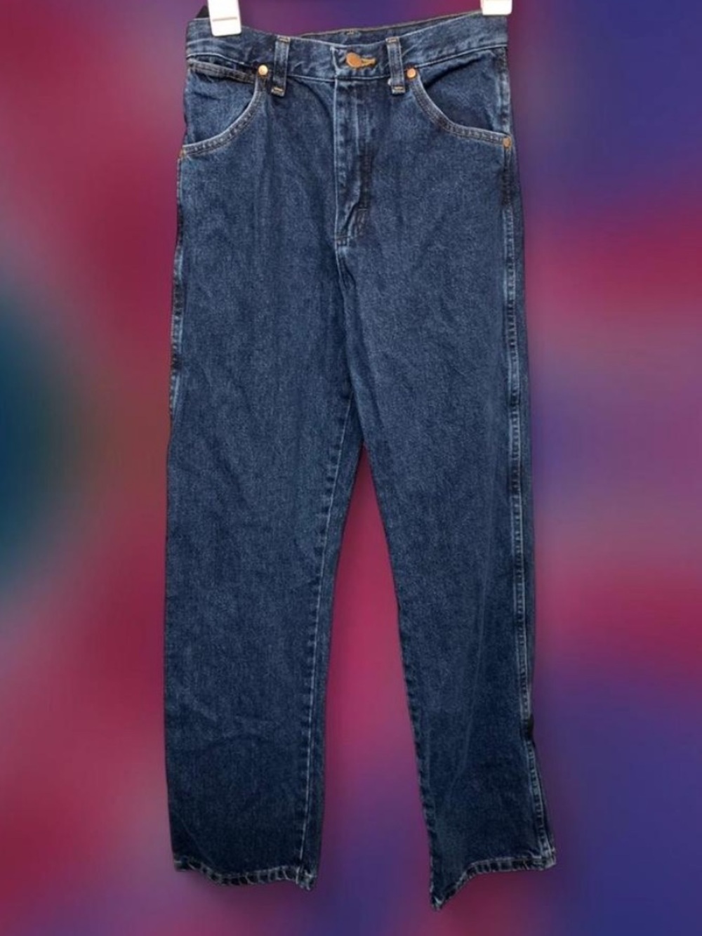Unisex children’s size 13 dark Wrangler blue denim jeans with a relaxed fit.